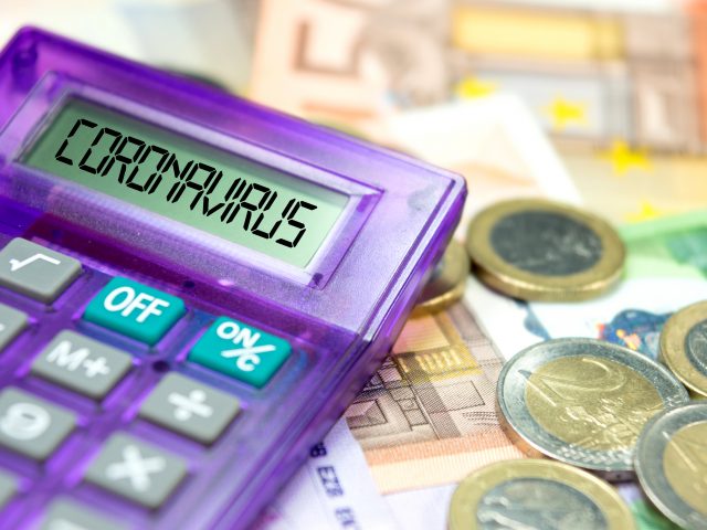 Calculator, Euro banknotes and coronavirus in Europe
